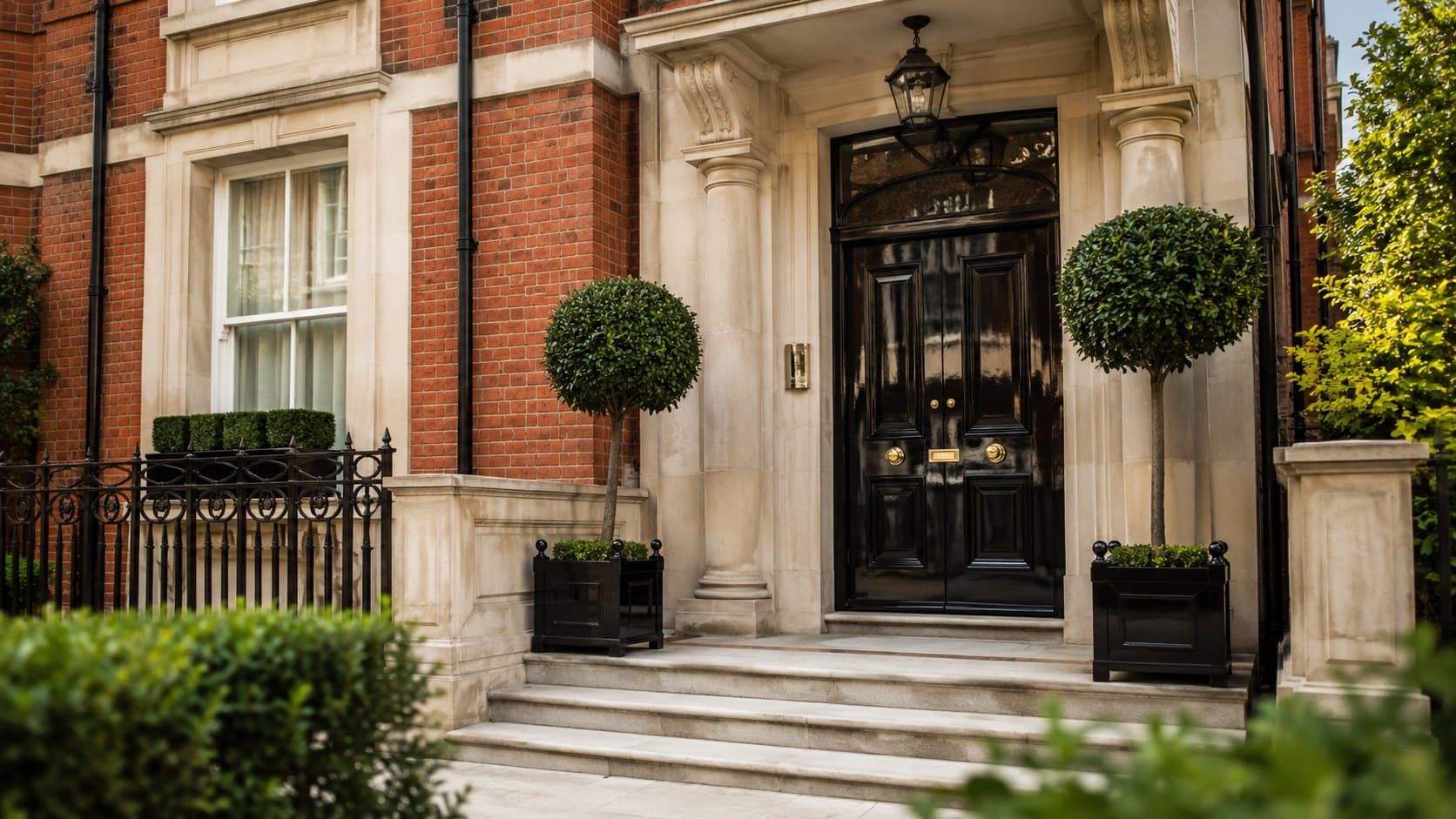 A red-brick mansion block entrance in Prime Central London